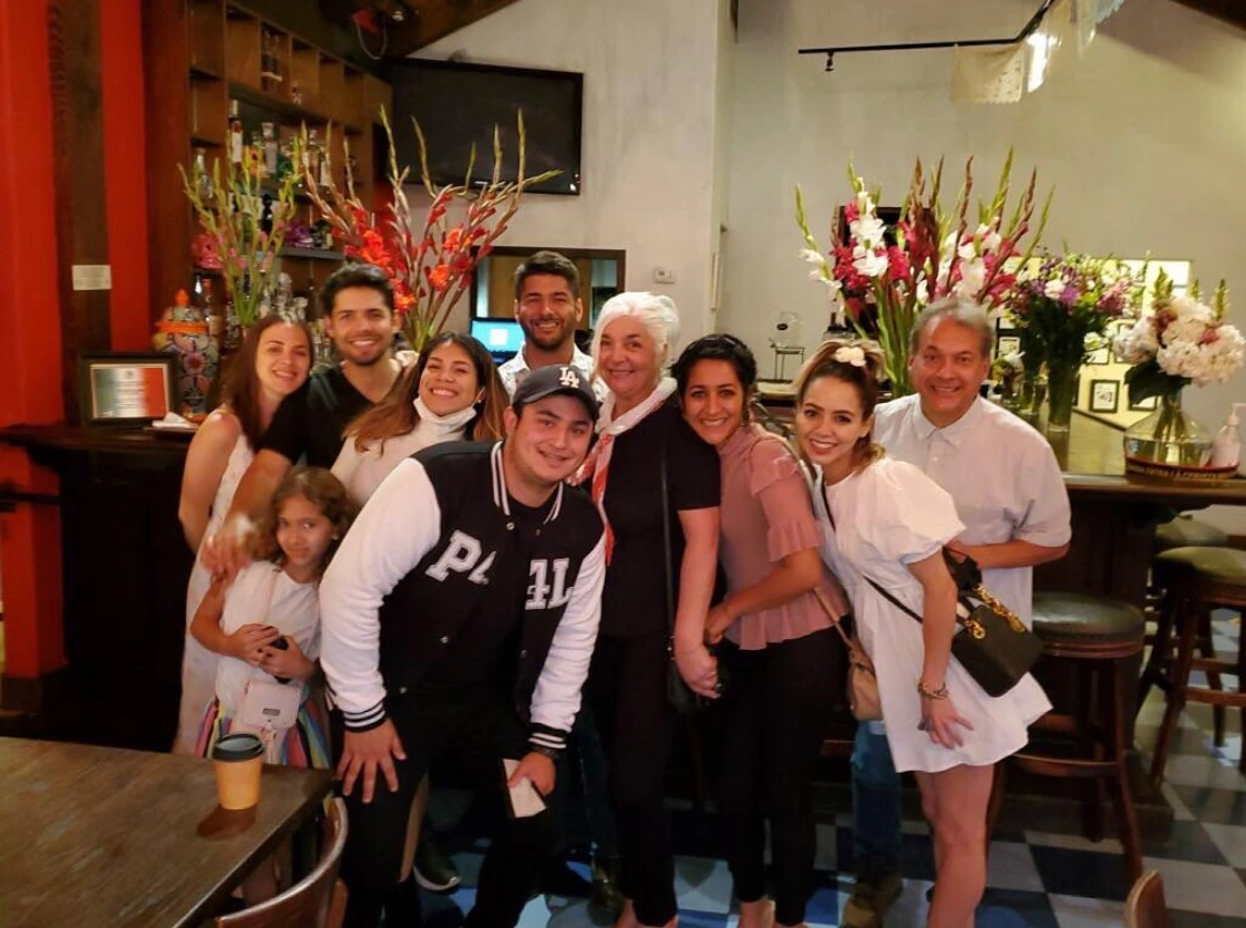 The Four Brothers family together in a restaurant.